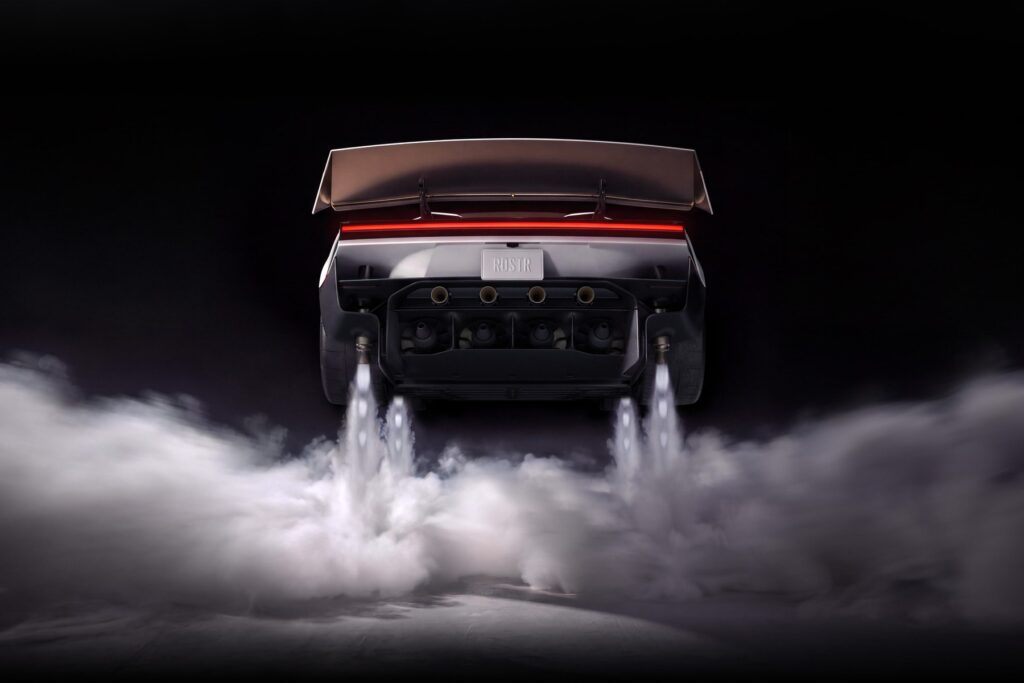 Arrière du Tesla Roadster avec ses propulseurs à gaz froid en action et un nuage de gaz au sol (image officielle Tesla)